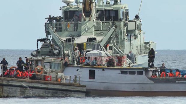 Australian Customs process a boatload of asylum seekers at Flying Fish Cove, Christmas Island.