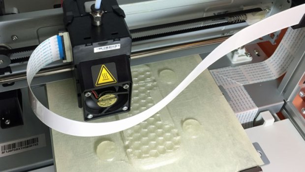 The printer uses a honeycomb internal structure to save plastic, which costs $60 per spool.