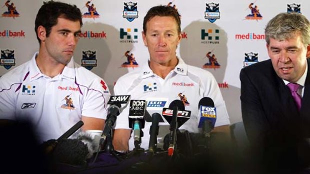 Pay-out ...  Storm coach Craig Bellamy, centre, and former CEO Brian Waldron, right, pictured here with Storm captain Cameron Smith, will cough up $105,000 plus legal costs.