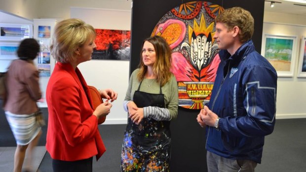 Employment Minister Michaelia Cash and Canning MP Andrew Hastie (pictured with local artist Emma Blyth) have announced a massive drop in unemployment in the city.