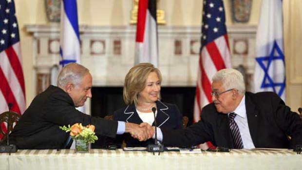 Israeli Prime Minister Benjamin Netanyahu left shakes hands with President Mahmoud Abbas of the Palestinian Authority as Secretary of State Hillary Rodham Clinton looks on. <i>Picture: New York Times</i>