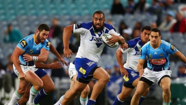 Bulk buy: Canterbury giant Sam Kasiano on the charge against the Gold Coast Titans.