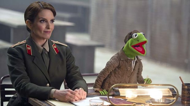 Tina Fey and Kermit in <em>Muppets: Most Wanted</em>.