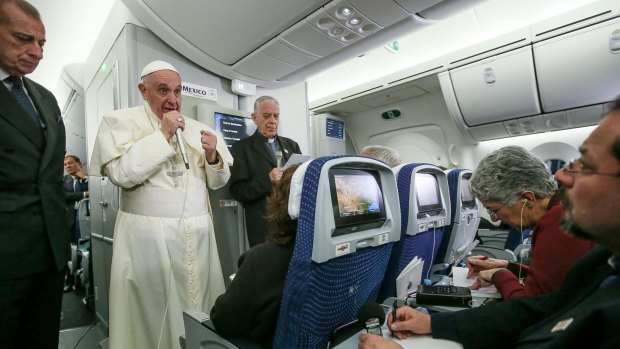 Pope Francis and journalists aboard the plane during the flight from Mexico to Italy on Wednesday.