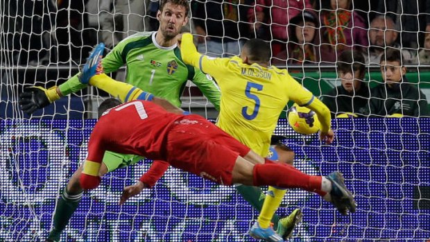 On the scoresheet: Portugal's Cristiano Ronaldo scores the opening goal past Sweden's Martin Olsson.