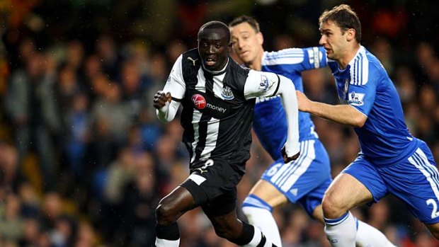Papiss Cisse of Newcastle splits the Chelsea defence during the Premier League match between Chelsea and Newcastle United.