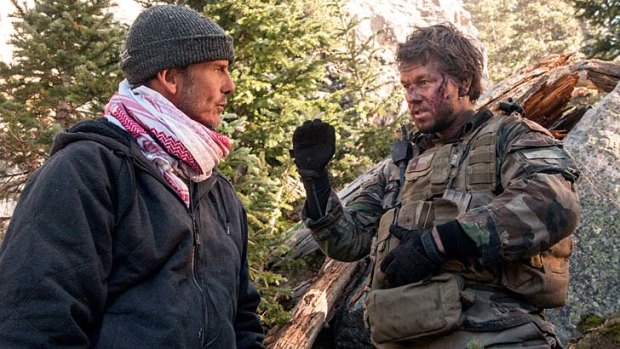 Director Peter Berg with Mark Wahlberg on the film set. Four active and former SEALs were present to guide the production for accuracy.