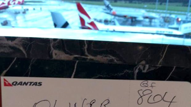 Twitter image of a handwritten boarding pass presented to a passenger in Brisbane this morning.