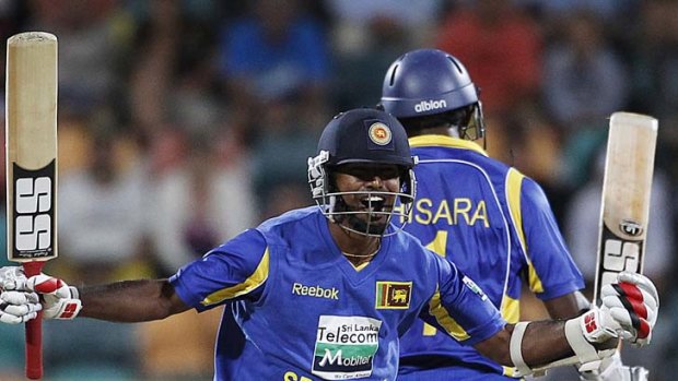 Sri Lanka's Nuwan Kulasekara (L) and Thisara Perera celebrate their victory.