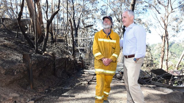 Malcolm Turnbull visits Wye River township areas destroyed  by the Christmas Day fires, with Wye River CFA Captain Roy Moriaty.