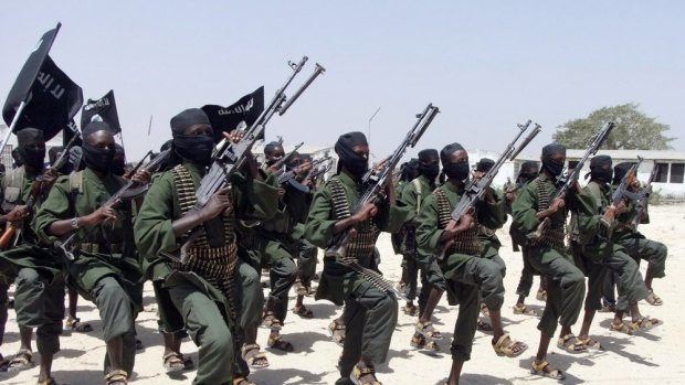 In this file photo, newly trained al-Shabab fighters perform military exercises in the Lafofe area just south of Mogadishu. A senior al-Shabab leader has promised to bring holy war to US.