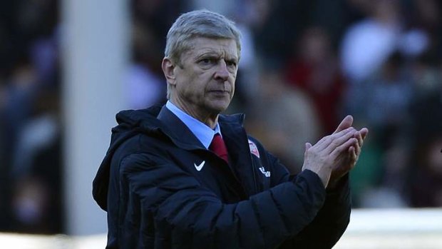 Plenty to cheer: Arsene Wenger's new three-year deal at Arsenal is understood to be worth more than $45 million.