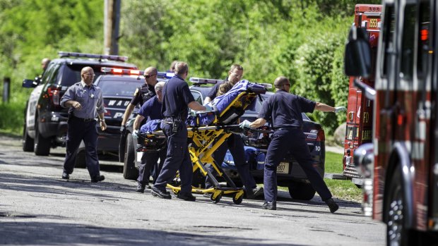 Rescue workers take a stabbing victim to an ambulance in Waukesha, Wisconsin, in May last year. Prosecutors say two 12-year-old girls stabbed their 12-year-old friend nearly to death in the woods to please a mythological creature they learned about online.
