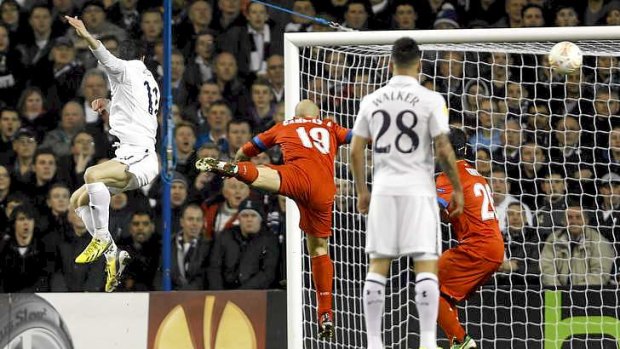 Gareth Bale of Tottenham Hotspurs heads the ball for a goal against Inter Milan.