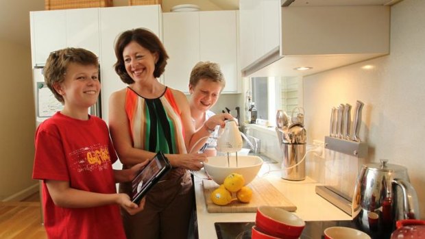 Lisa McLean, with sons Declan (left) and Hayden, has ditched cookbooks for  her iPad.