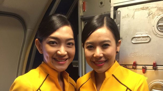 Nok Air's all-female crew wear sunny yellow uniforms.
