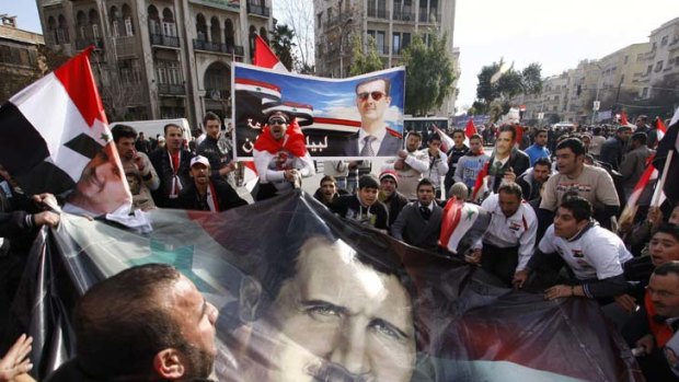 State TV has condemned a "conspiracy" against the regime of the President, Bashar al-Assad.