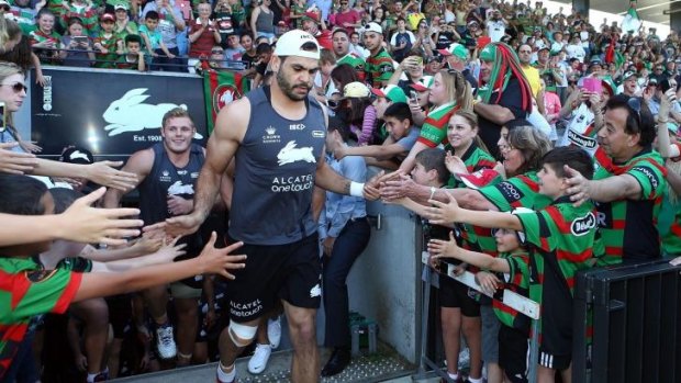 The Rabbitohs run out to train at the club’s fan day on Monday.
