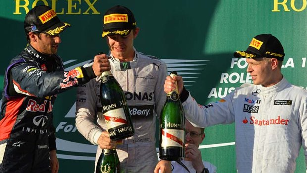 Daniel Ricciardo (second), Nico Rosberg (first) and Kevin Magnussen (third) get ready to break out the champagne on the podium.