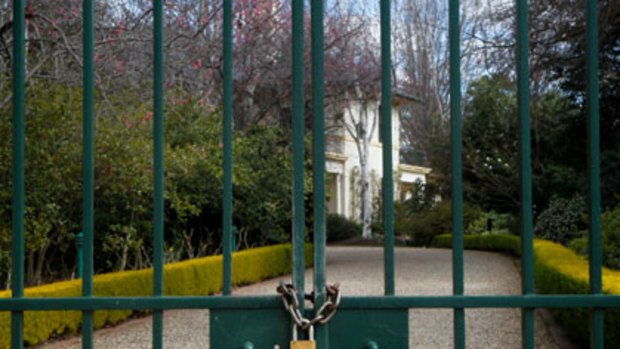 Anyone seen the key? ... the gates of The Lodge in Canberra remain padlocked yesterday.