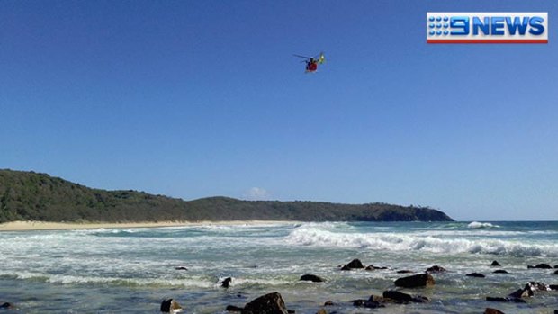 A helicopter searches for a man who went missing at Noosa.