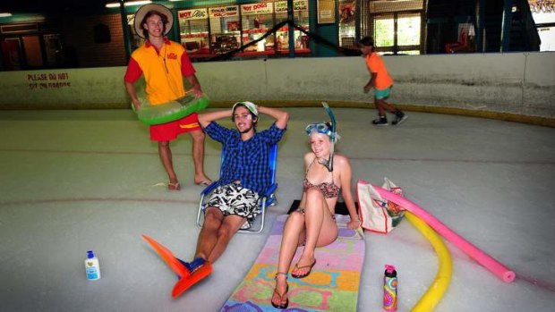 Cooling off at the Phillip skate rink during Canberra's hottest days are Woden swimming pool Lifeguard Rupert Denham, Alex Santiago, 19 of Jerrabomberra and Becky Bollen, 20 of Torrens.