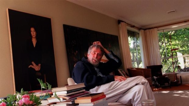 Pierre Ryckmans at home in Canberra in 1999 with a portrait of his daughter, publisher Jeanne Ryckmans, by Matthew Lynn.