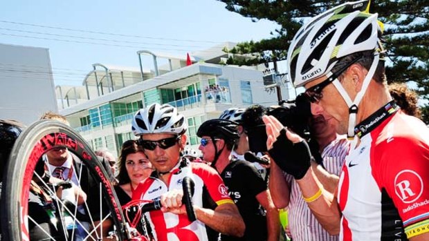 Charity ride ... Lance Armstrong, right, and teammate Robbie McEwen in Adelaide yesterday.