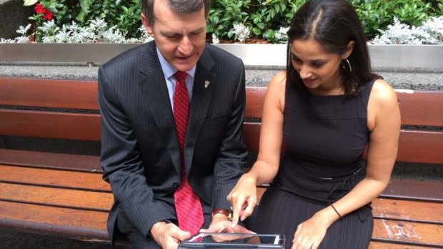 Lord Mayor Graham Quirk and Molly Taylor try out Brisbane's free Wi-Fi.