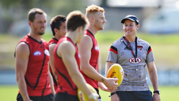People person: Essendon coach John Worsfold with his players during a training session.