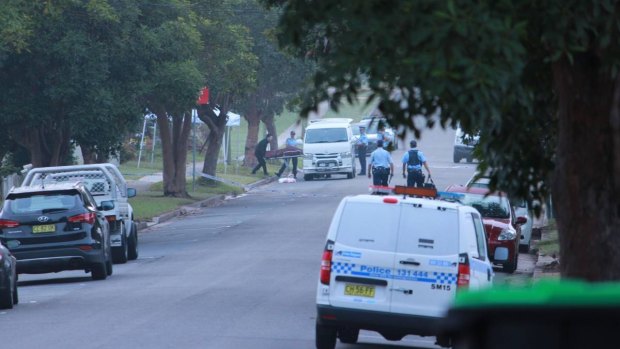 Mr Davey's body is removed from the scene on Stafford Street, Kingswood, on Wednesday morning.