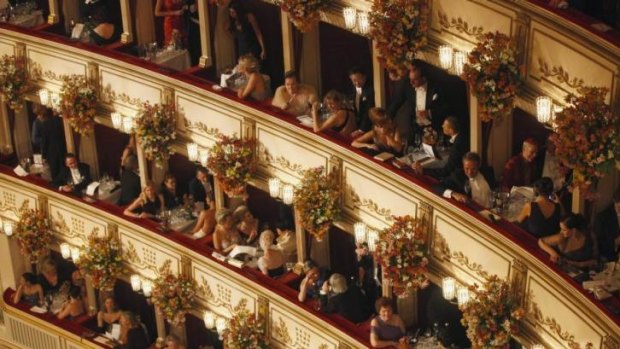 Awaiting Strauss: People sit in their boxes at the Vienna State Opera House.