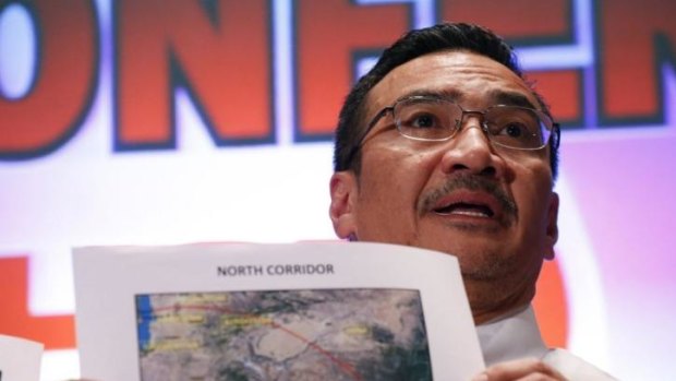 Malaysia's acting Transport Minister Hishammuddin Hussein shows a map with the northern corridor where Malaysia Airlines Flight MH370 may have reached.