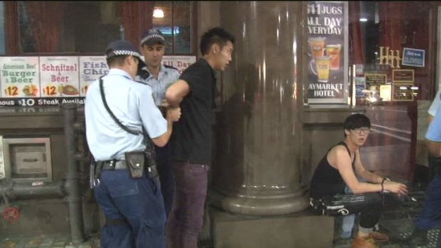 Fright night: A man is held after a brawl in Haymarket.