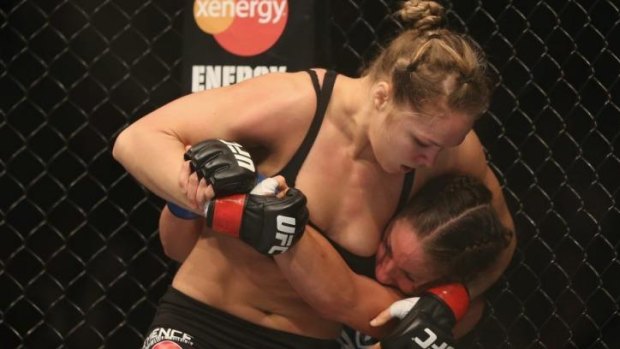 Rousey fighting Liz Carmouche at UFC 157.