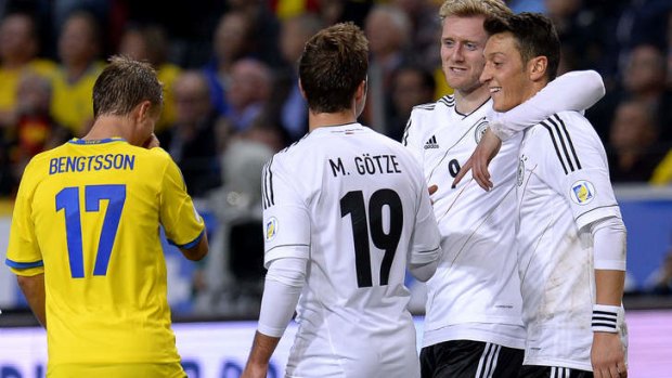 Andre Schurrle celebrates with his teammates after scoring.