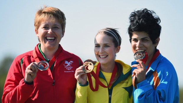On the podium ... from left, Elena Allen of Wales, Laura Coles of Australia and Andri Eleftheriou of Cyprus receive their medals after winning the Women's Skeet final at Barry Buddon Shooting Centre.