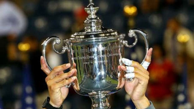 Crowning glory . . .  Rafael Nadal of Spain has become the seventh man to win all four grand slam events after claiming his first US Open title today.