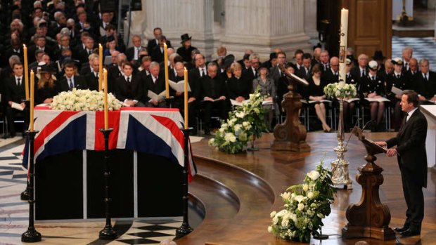 New generation: British Prime Minister David Cameron gives a reading by the coffin.