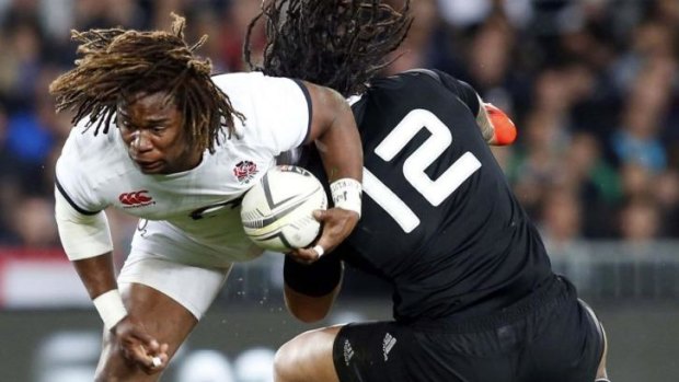 Clash of the Titans: Ma'a Nonu tackles England's Marland Yarde.
