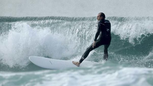 Manly magician ...  Mark Kelly on his surfboard which won an Australian International Design Award. The design  combines  elements of  both short and long boards