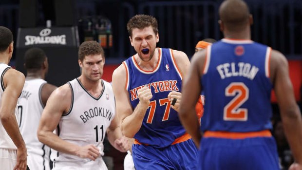 New York Knicks forward Andrea Bargnani reacts after sinking a shot in the first half at the Barclays Center. Bargnani scored 16 points as the Knicks defeated the Nets 113-83.