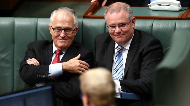 Communications MInister Malcolm Turnbull, pictured with Immigration Minister Scott Morrison, in question time on Wednesday.