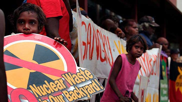 Aborigines and environmentalists stage a protest yesterday at a bridge near the proposed site of the Muckaty nuclear waste dump in the Northern Territory.