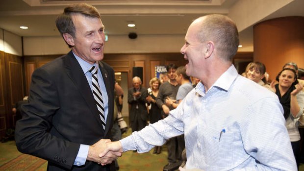 Graham Quirk shakes hands with Campbell Newman.