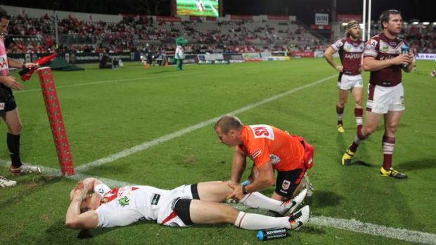 Ouch: Dragons winger Brett Morris injured during St George Illawarra's loss to Manly at Kogarah on Monday night.