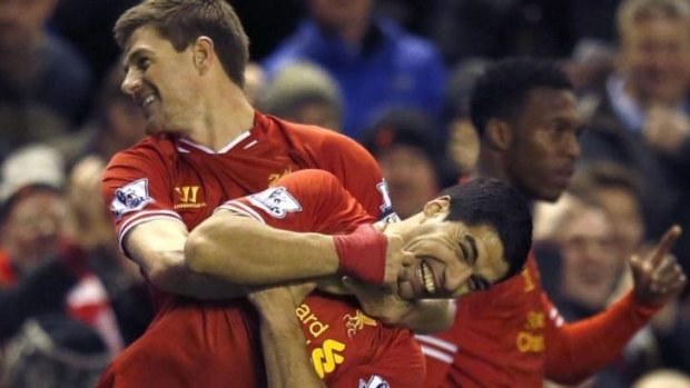 Longstanding captain Steven Gerrard celebrates with Uruguayan striker Luis Suarez.