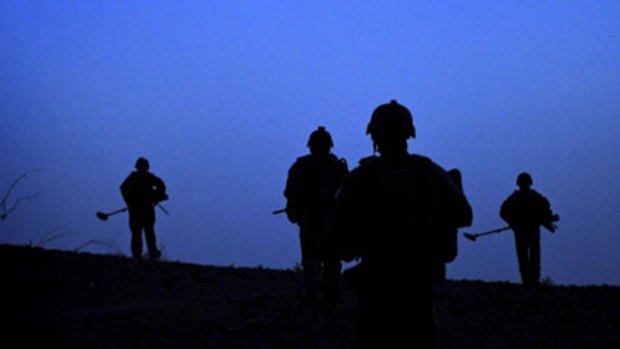 Dangerous mission  ... at first light, Australian soldiers  patrol through the Mirabad Valley region of Uruzgan province, Afghanistan.