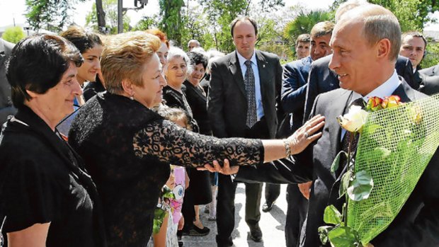 Russian Prime Minister Vladimir Putin meets locals in Abkhazia.