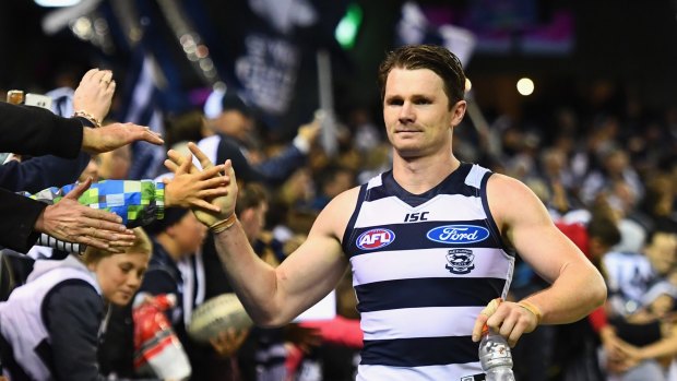 Cats star Patrick Dangerfield celebrates with fans after beating the Kangaroos.